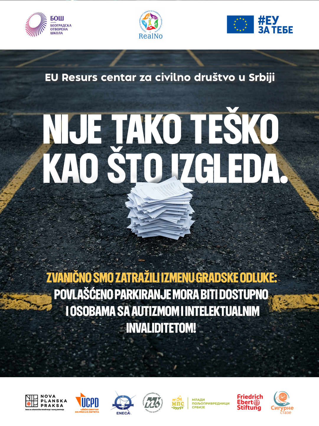 Žuti znak NE PARKIRAJ PRAVO POD TEPIH na parking mestu — vizual inicijative UG Realno